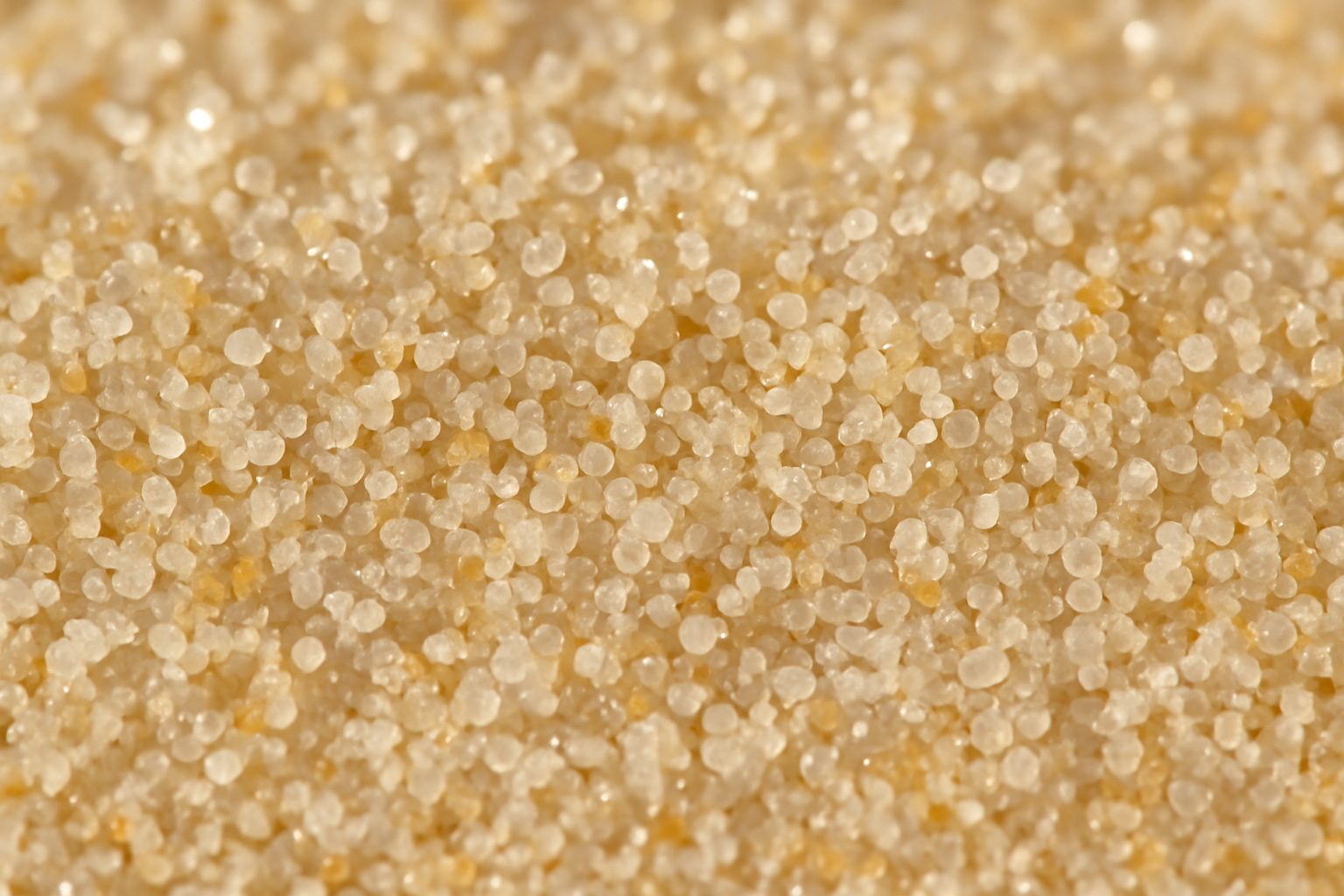 Designing the Perfect Pickle Ball Court with Silica Sand Supplier in Philippines 1 Close-up of uniform, high-purity silica sand particles used in sports surfaces.
